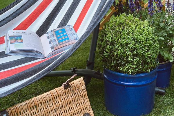 garden furniture with a plant and magazine